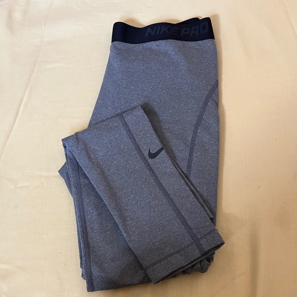 Nike pro leggings and 2 Nike Dri~Fit muscle shirt size L